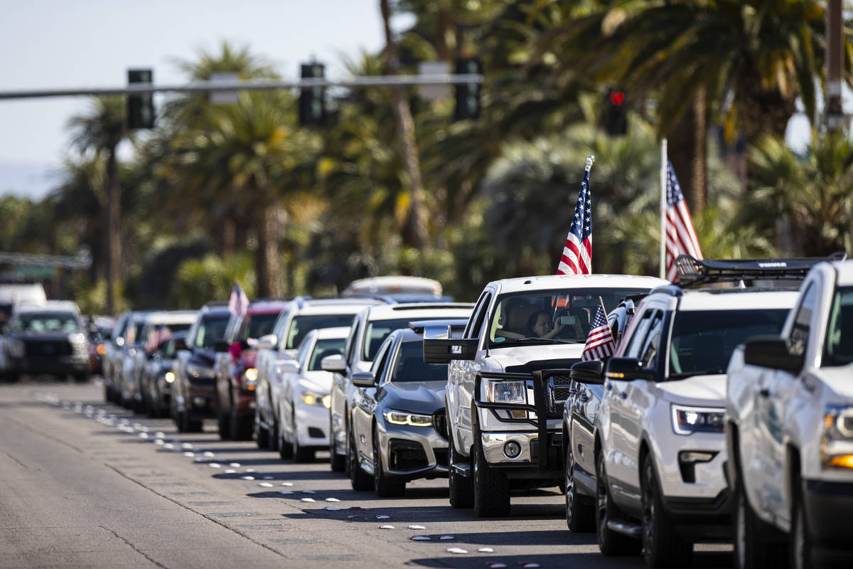 People participate in a "caravan" protest led by Wayne Allyn Root, not pictured, alon ...