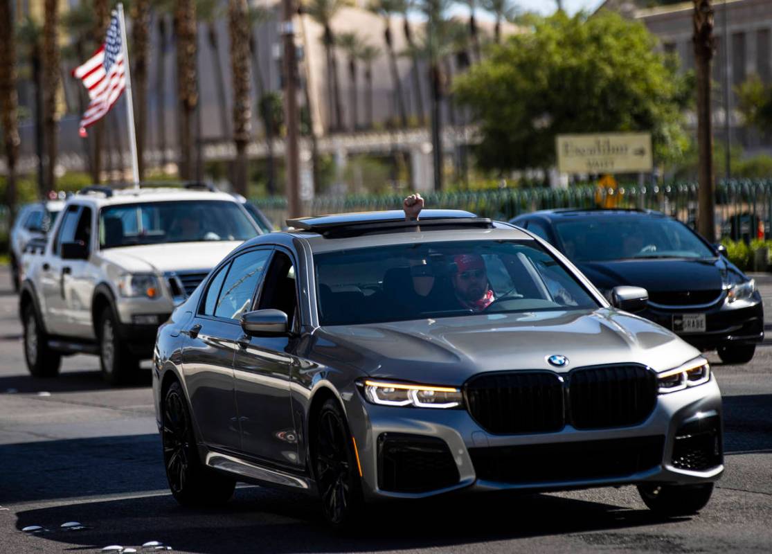 People participate in a "caravan" protest led by Wayne Allyn Root, not pictured, alon ...