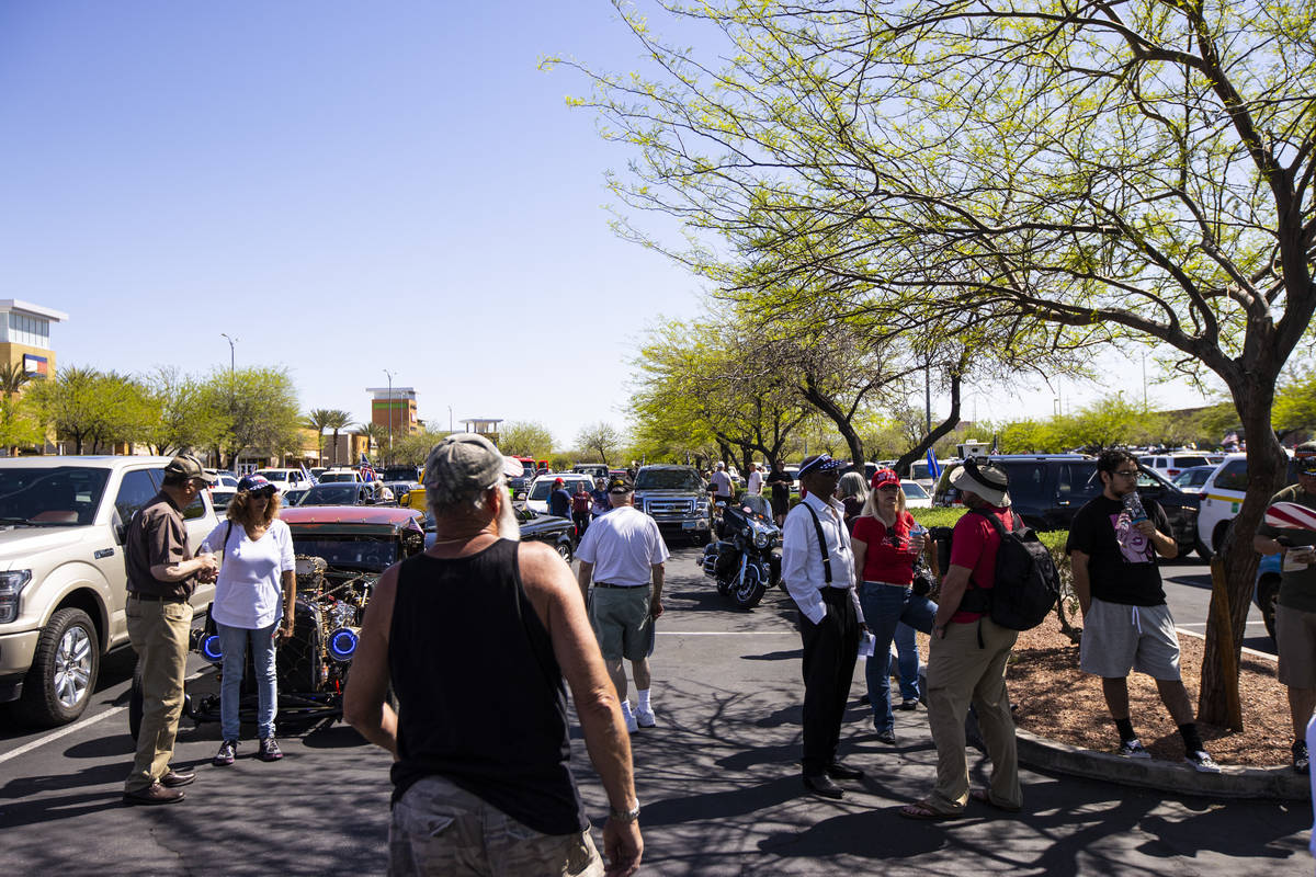 People gather at the Las Vegas South Premium Outlets before participating in a "caravan&qu ...