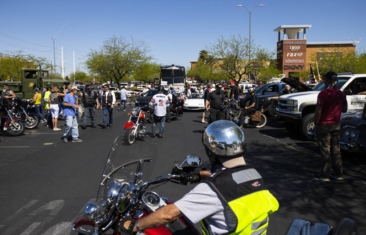 People gather at the Las Vegas South Premium Outlets before participating in a "caravan&qu ...