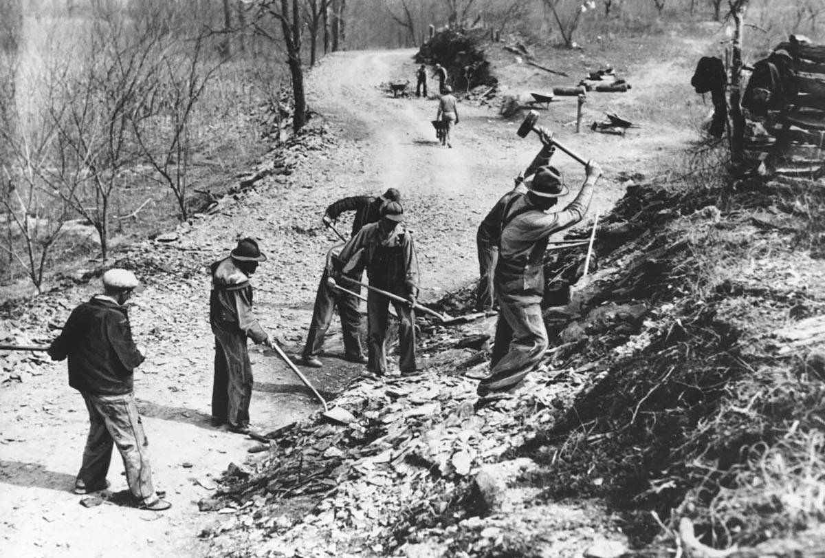 In this March 9, 1936, file photo Works Progress Administration (WPA) workers build a new farm- ...