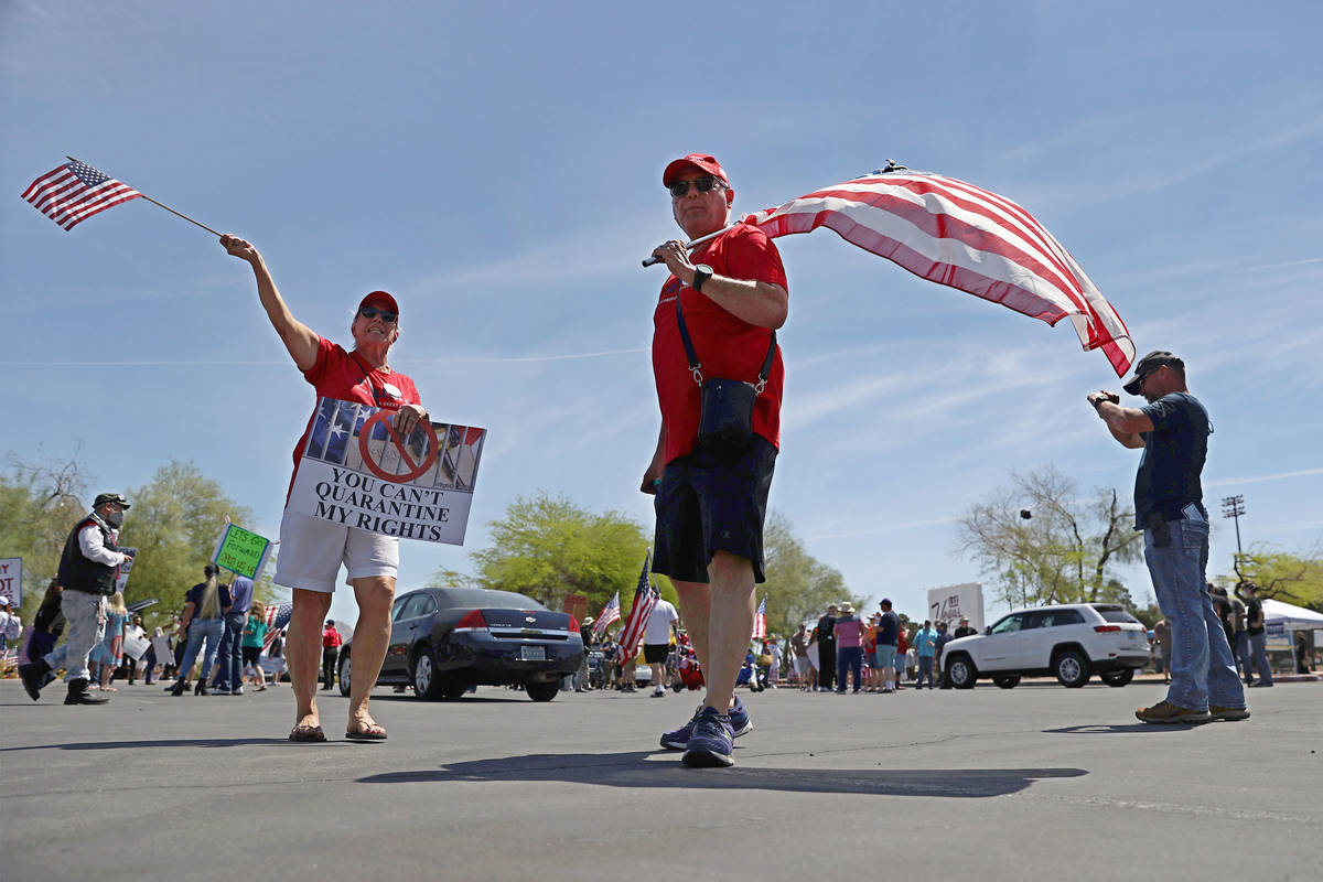 Joann Nemeth, left, and her husband Joe of Las Vegas, center, attend a Fight For Nevada rally o ...