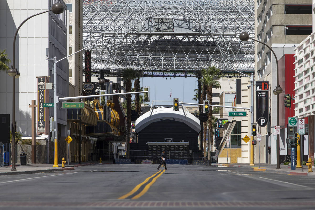 Downtown Las Vegas is empty but for a few roaming people on Saturday, April 25, 2020, in Las Ve ...