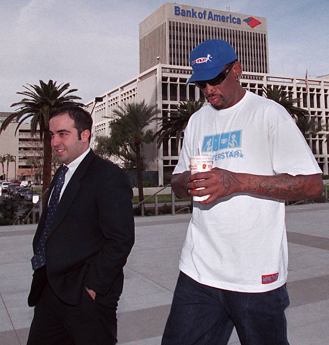 Dennis Rodman walks into federal court in Las Vegas on Dec. 11, 2000, with his attorney for a d ...