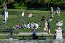 People enjoy the weather in Kensington Gardens, as the UK continues its lockdown to help curb t ...