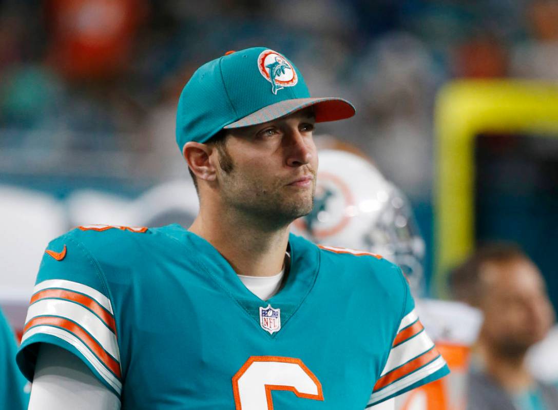 Miami Dolphins quarterback Jay Cutler (6) looks from the sidelines, during the first half of an ...
