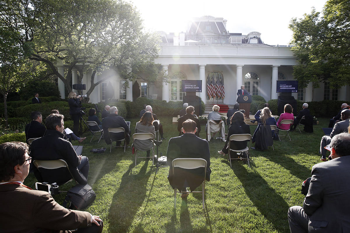 President Donald Trump speaks about the coronavirus in the Rose Garden of the White House, Mond ...