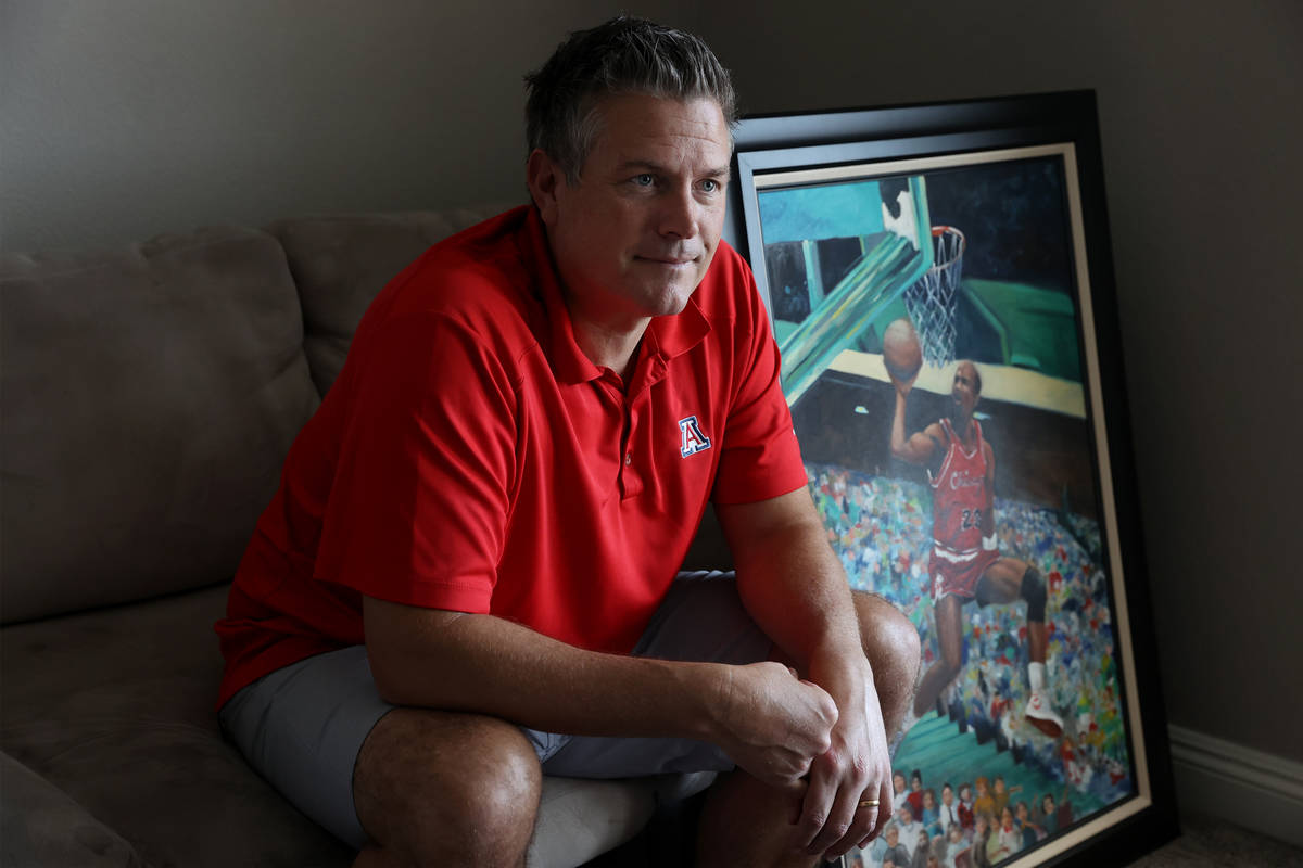 Trent Othick poses in front of a Michael Jordan painting inside his Las Vegas home, Tuesday, Ap ...