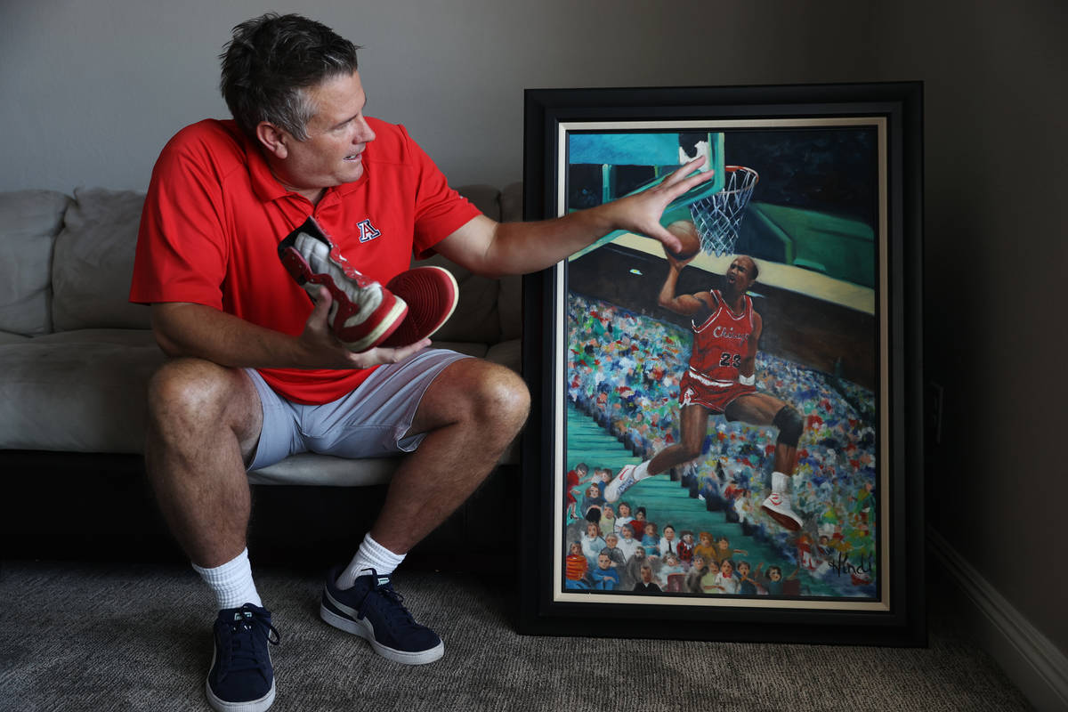 Trent Othick shows a paining of Michael Jordan painting inside his Las Vegas home, Tuesday, Apr ...