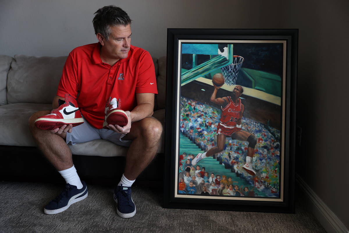 Trent Othick shows a paining of Michael Jordan painting inside his Las Vegas home, Tuesday, Apr ...