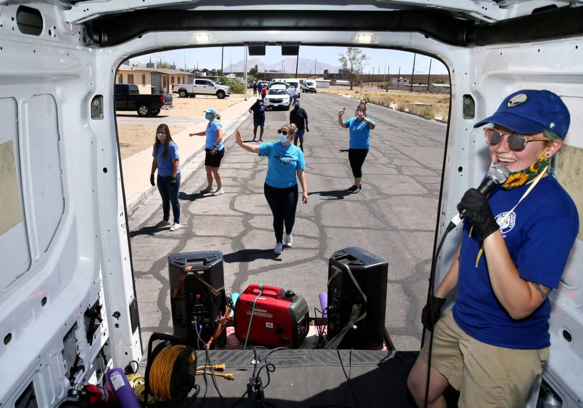 Clark County Parks and Recreation Department staff members, including Dani Garcia, in van, host ...