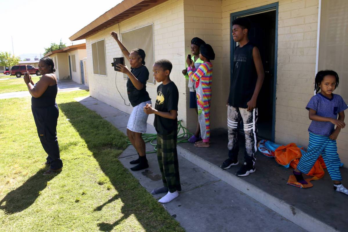 Residents dance as Clark County Parks and Recreation Department staff members host a socially d ...