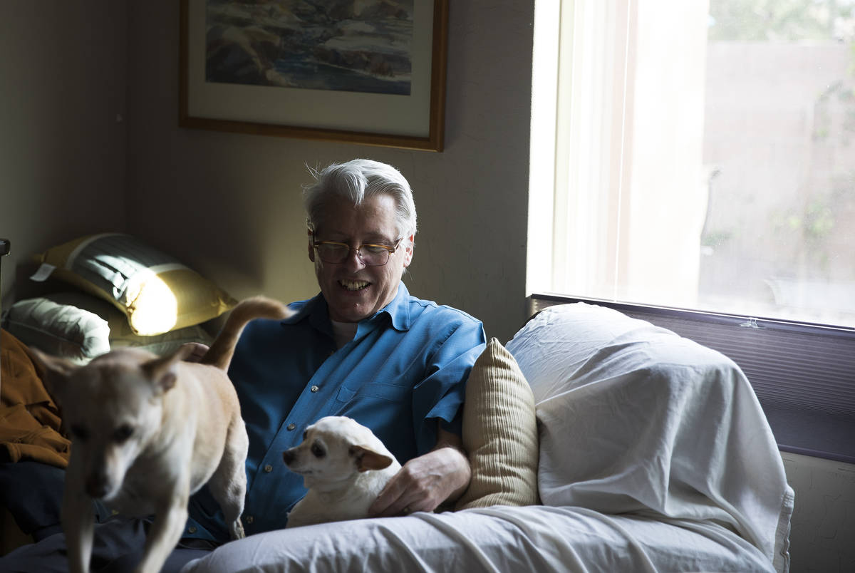 Richard Davis with his dogs Benji and Zoey at his home in North Las Vegas, Monday, April 27, 20 ...