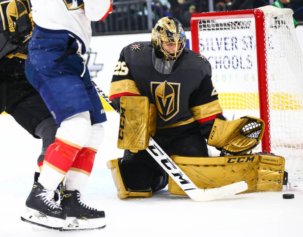 Golden Knights goaltender Marc-Andre Fleury (29) stops the puck from the Florida Panthers durin ...