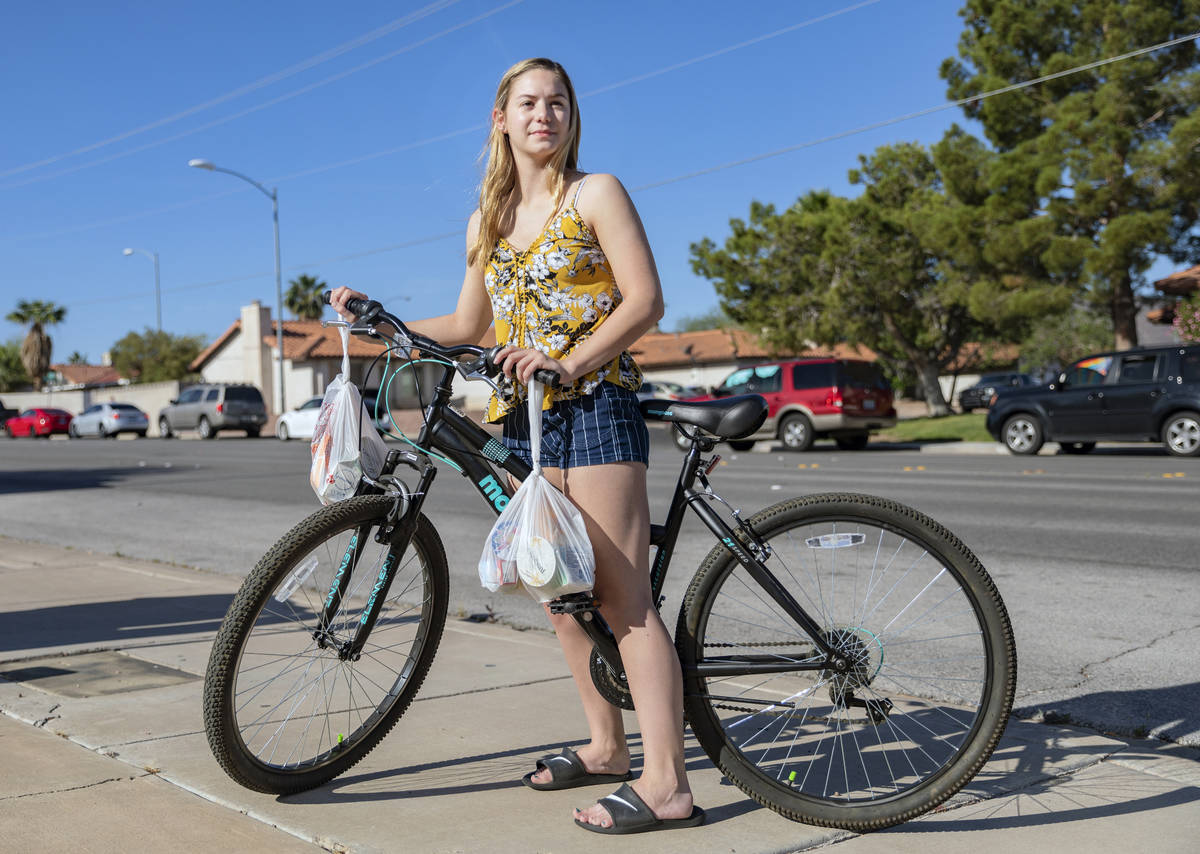 Emily Hartung, 18, a senior at Basic Academy of International Studies, leaves the CCSD food dis ...