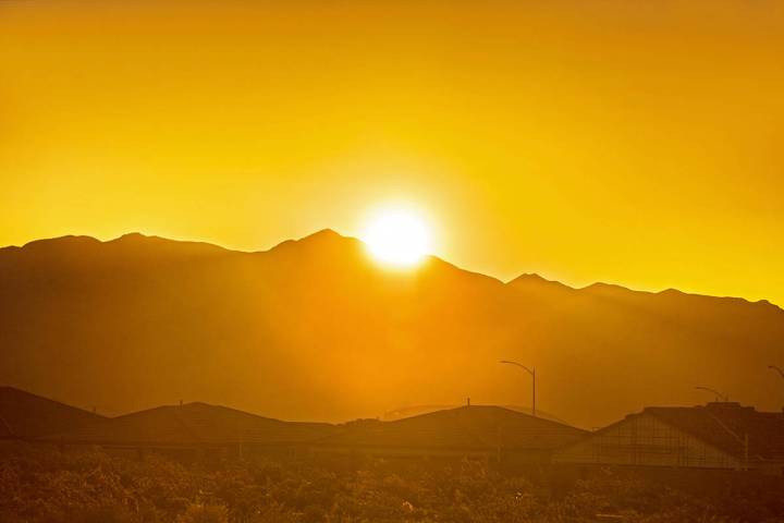 The sun rises in the northwest Las Vegas Valley on Wednesday, June, 5, 2019, in Las Vegas. The ...