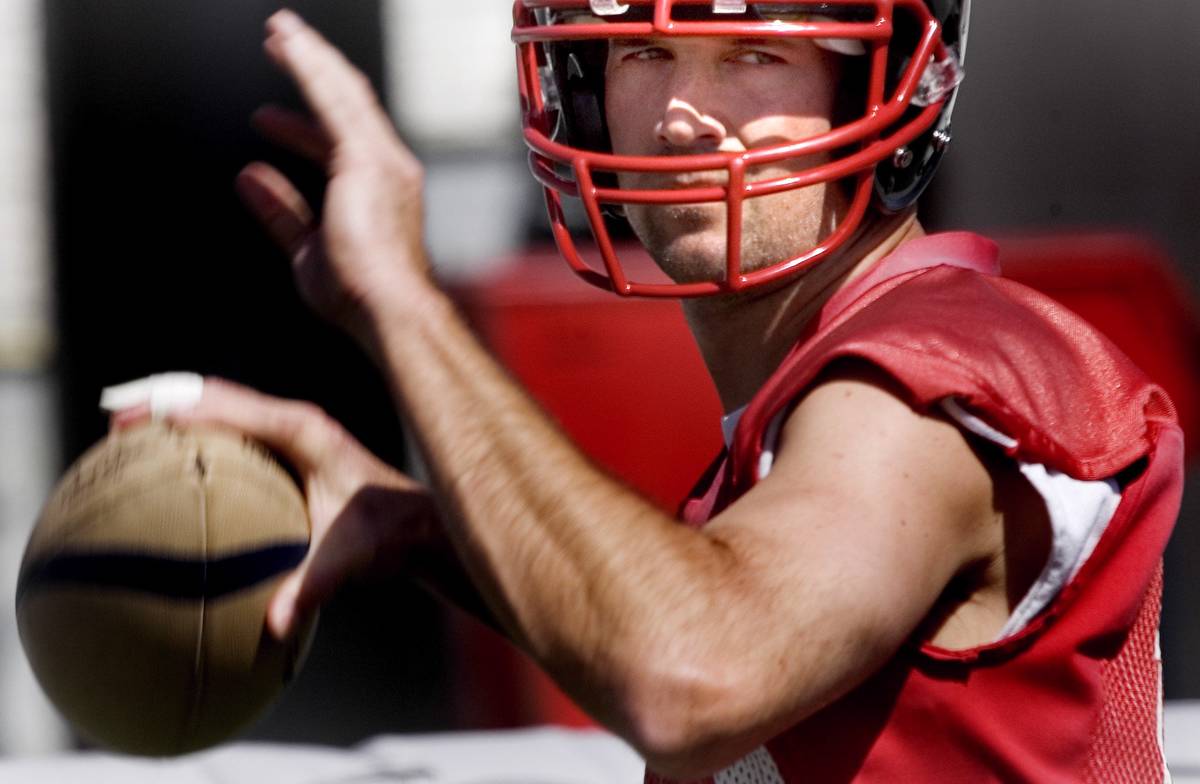 Sports; Gladiatiors quarterback, Clint Dolezel looks to throw a pass during practice at Sam Boy ...