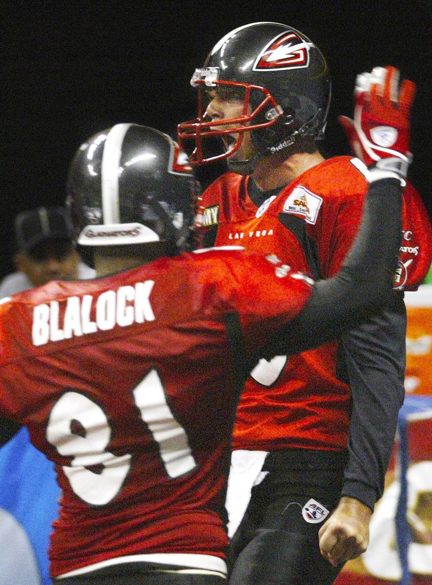 SPORTS - Gladiator quarterback Clint Dolezel celebrates his game sealing touchdown in the fourt ...
