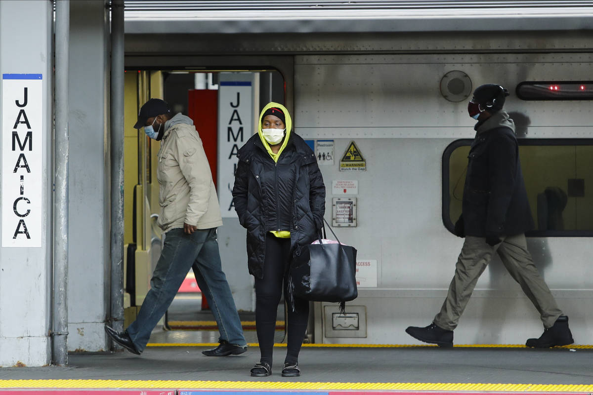 Commuters wait for trains at the LIRR Jamaica station Wednesday, April 29, 2020, in the Queens ...