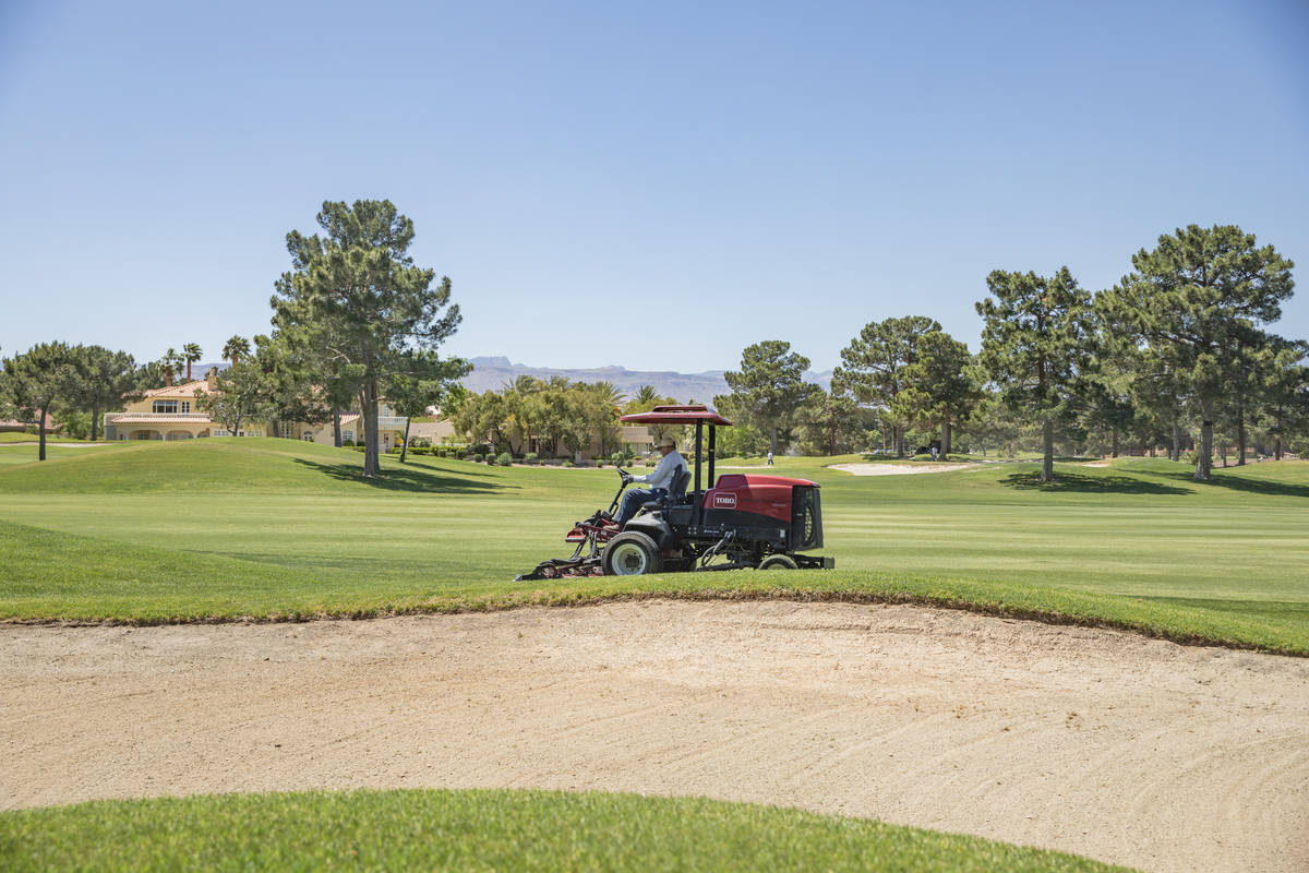 Groundskeeping is done to prepare for the opening of the Spanish Trail Country Club and Golf Co ...