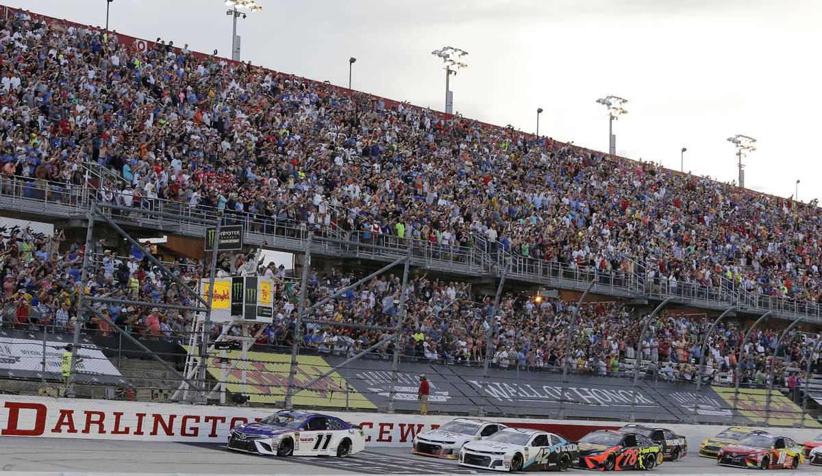 FLE - In this Sept. 2, 2018, file photo, Denny Hamlin (11) leads the pack to start the NASCAR C ...