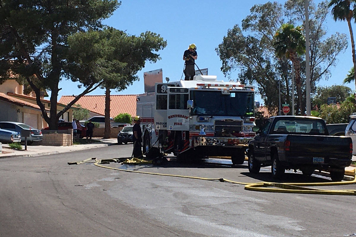 Crews battle a fire Thursday, April 30, 2020, on the 300 block of Esquina Drive in Henderson. ( ...