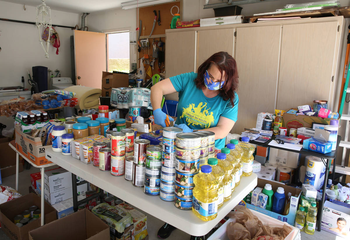 Jeana Taylor, founder of Vegas Community Pantry, displays items at her garage as she waits for ...