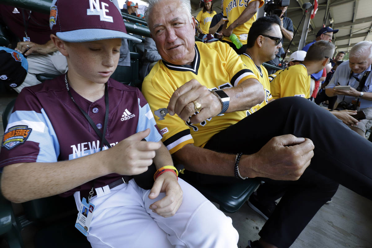 FILE - In this Aug. 18, 2019, file photo, Pittsburgh Pirates' Clint Hurdle, right, hands a comm ...