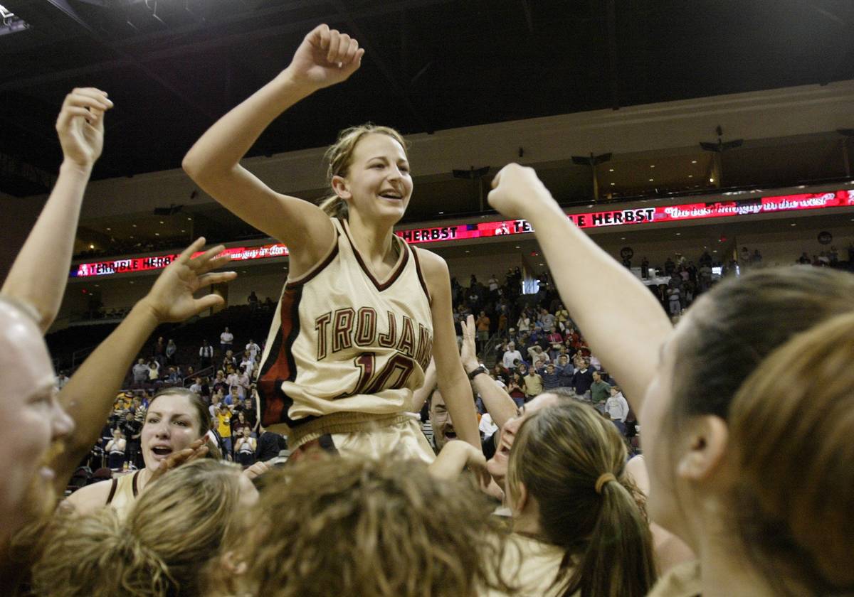 Pahrump Vally girls lift up Melanie Maeder #10 after she hit a three-pointer at the buzzer to w ...