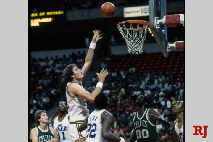 Utah Jazz center Mark Eaton goes for a shot as the Celtics' Robert Parrish (00) watches during ...