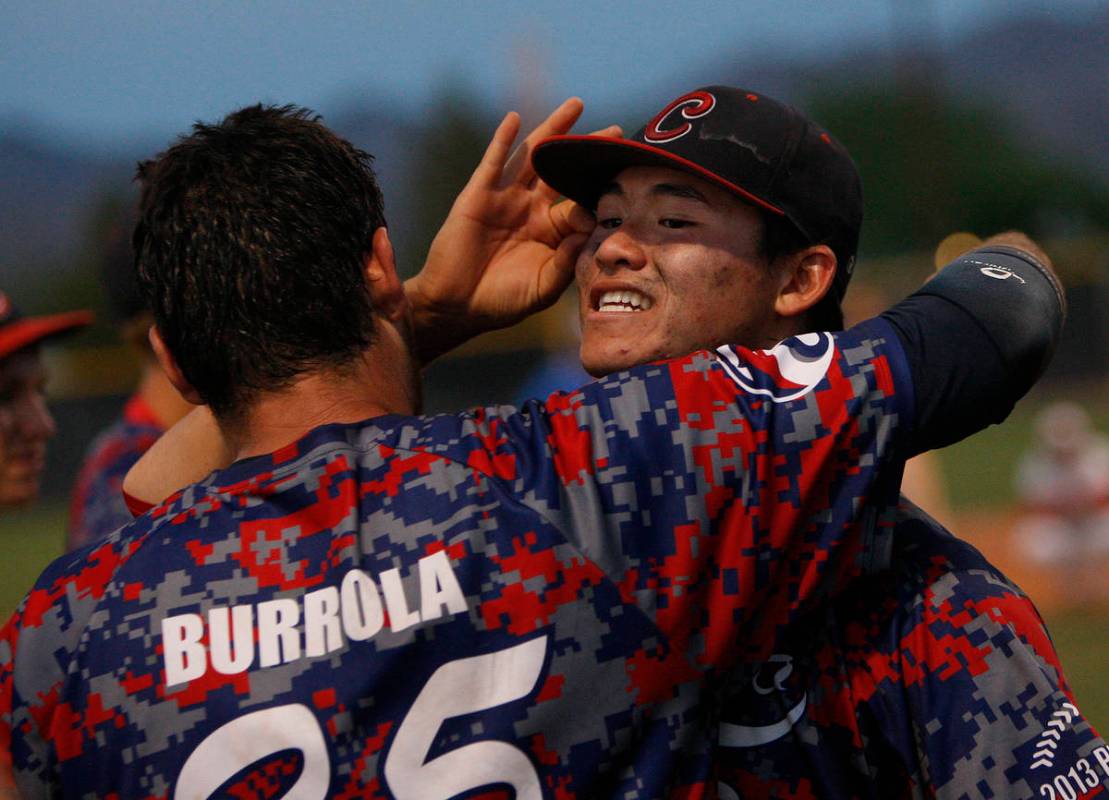 Coronado High School players Chandler Blanchard, right, and Julian Burrola celebrate after defe ...