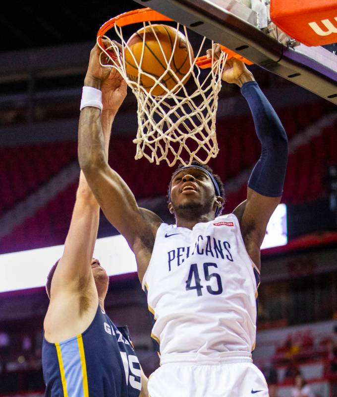 New Orleans Pelicans forward Zylan Cheatham, right, gets inside for a shot inside of Memphis Gr ...