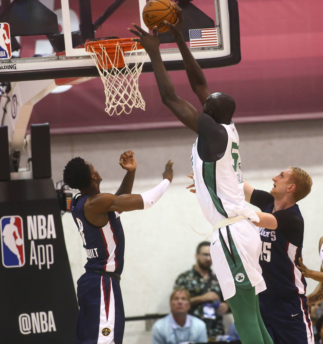 Boston Celtics' Tacko Fall (55) shoots over Denver Nuggets' Jarred Vanderbilt during a basketba ...