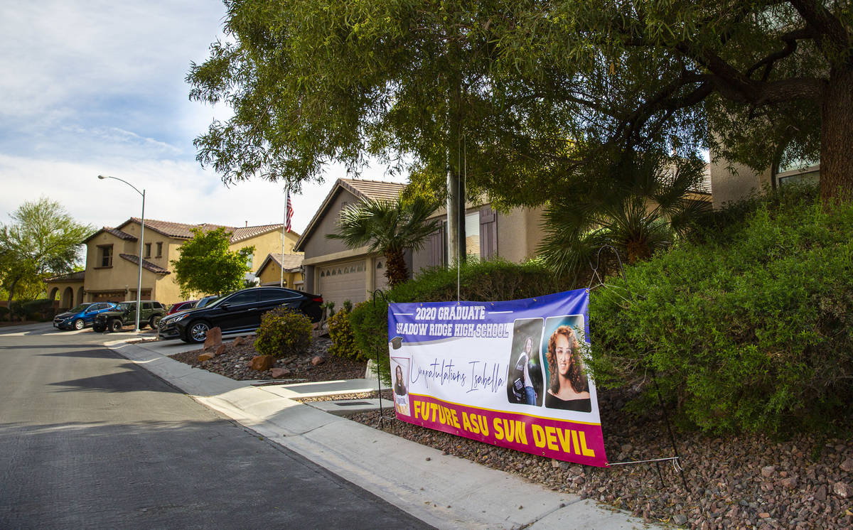 A sign outside the home of Isabella Rowles, a senior graduating from Shadow Ridge High School, ...
