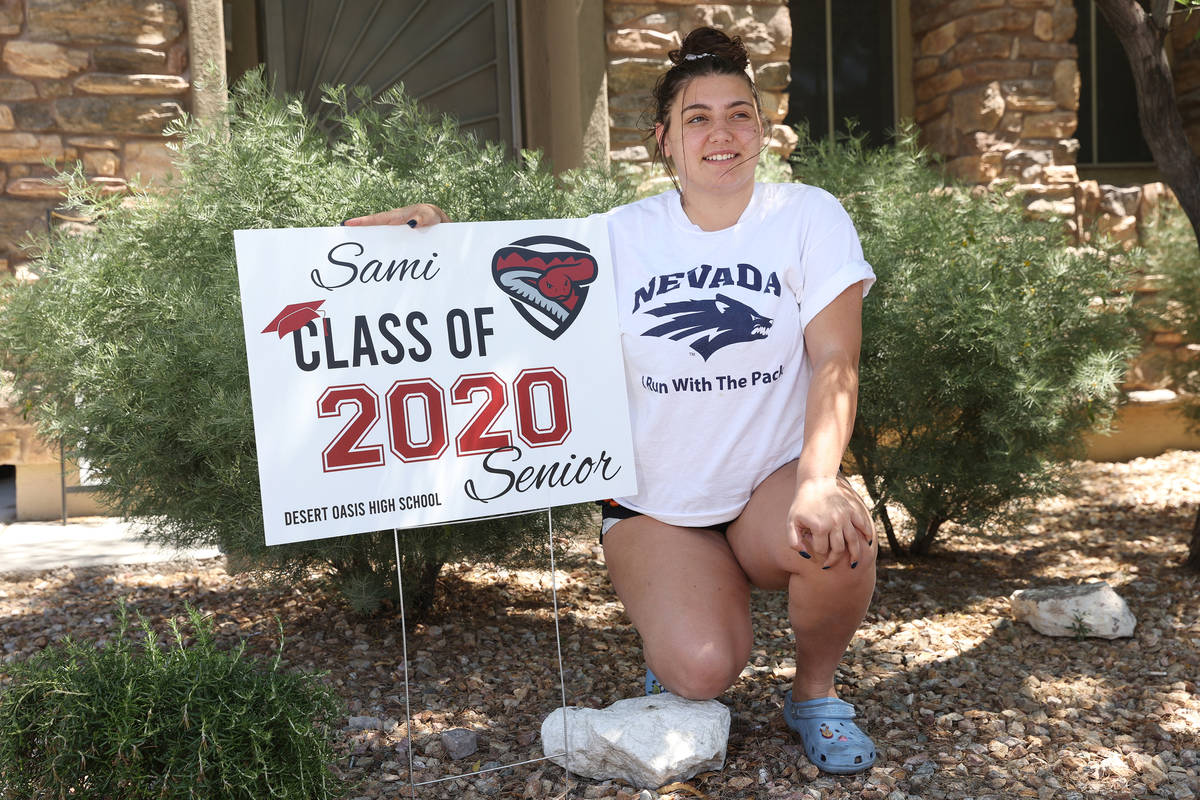 Desert Oasis High School senior Samantha Gato, 18, poses in front of a yard sign at her Las Veg ...