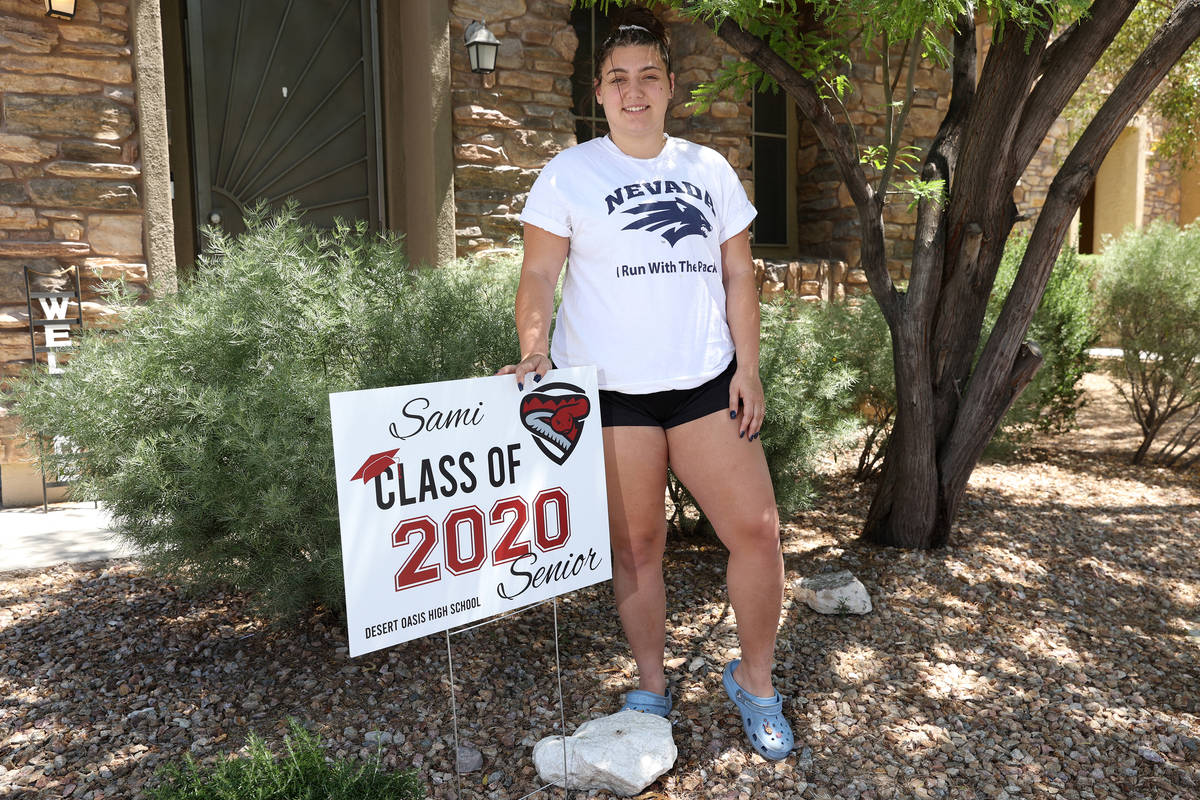 Desert Oasis High School senior Samantha Gato, 18, poses in front of a yard sign at her Las Veg ...