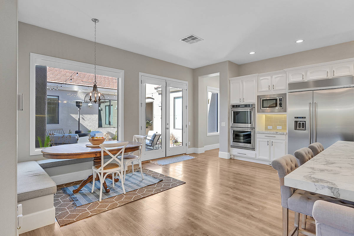 A breakfast nook with a built-in bench is a quaint spot. (Huntington & Ellis)