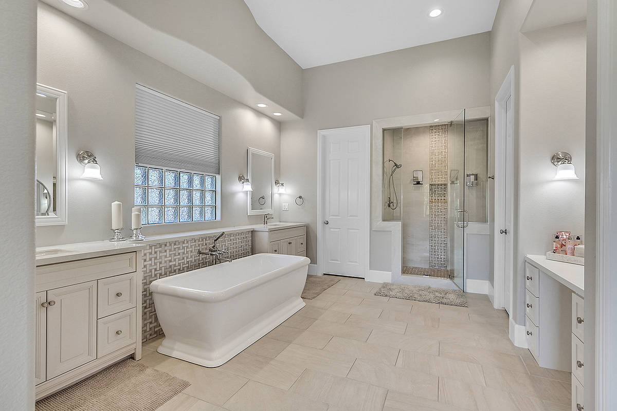 The master bath features a soaking tub and quartz countertops. (Huntington & Ellis)