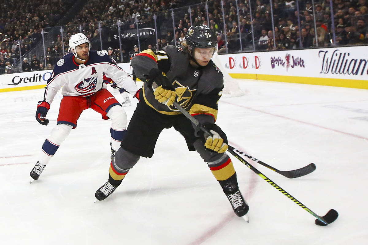 Golden Knights' William Karlsson (71) skates with the puck in front of Columbus Blue Jackets' S ...