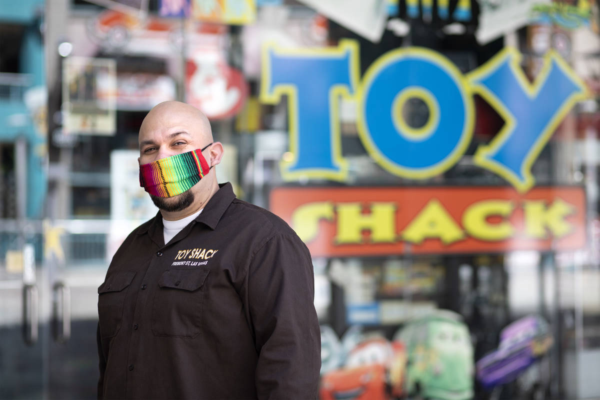 Johnny Jimenez Jr., owner of Toy Shack, stands for a portrait next to his store in the Neonopol ...