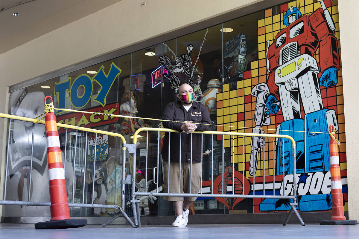 Johnny Jimenez Jr., owner of Toy Shack, stands for a portrait next to his store in the Neonopol ...