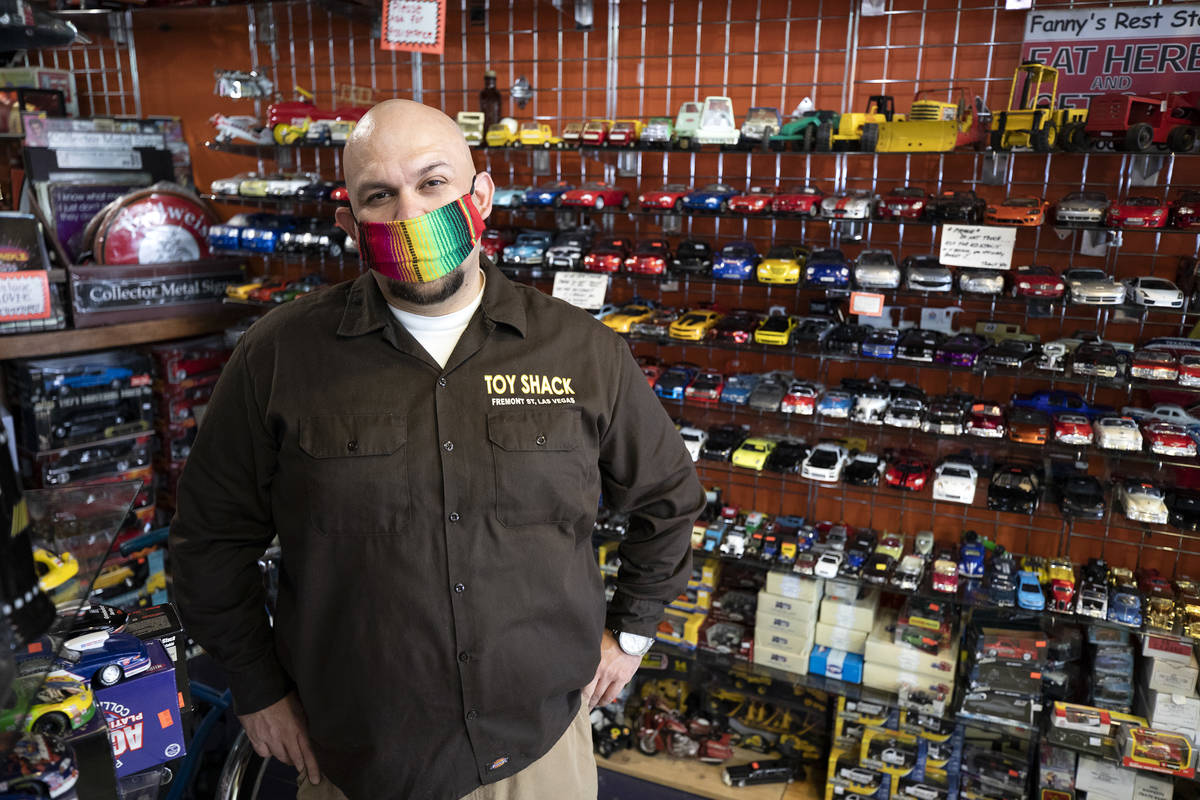Johnny Jimenez Jr., owner of Toy Shack, stands for a portrait in his store in the Neonopolis sh ...