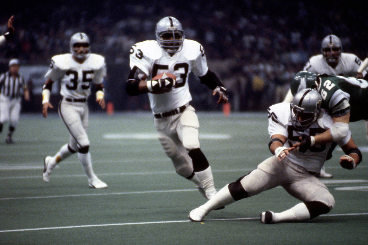 Oakland Raiders linebacker Rod Martin (53) intercepts a pass and runs upfield during Super Bowl ...