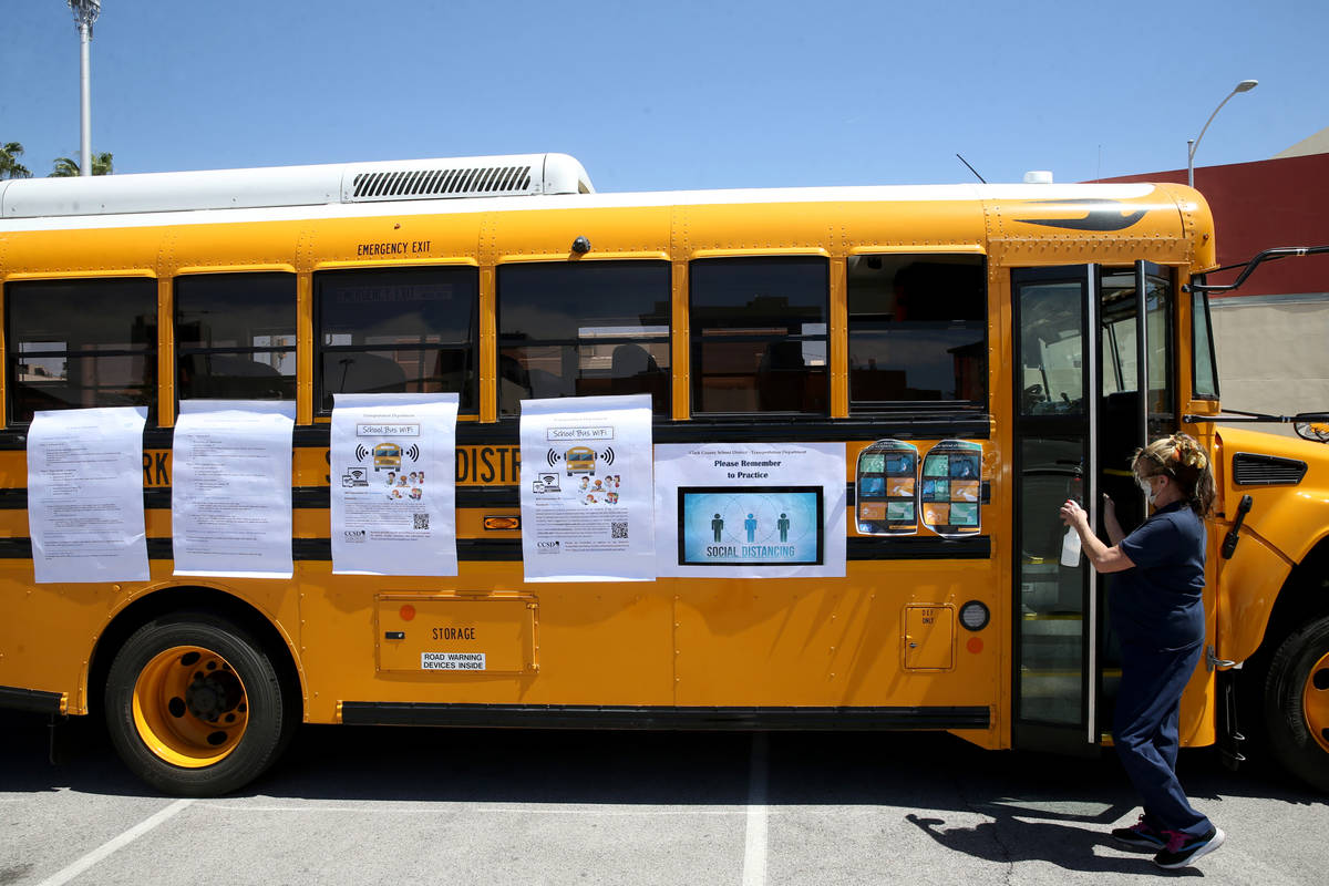 Clark County School District bus driver Marie Grootonk brings a Wi-Fi school bus for students o ...
