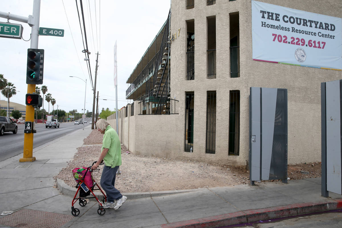 Robert Godleski, 73, makes his way down Foremaster Lane at Las Vegas Boulevard in downtown Las ...