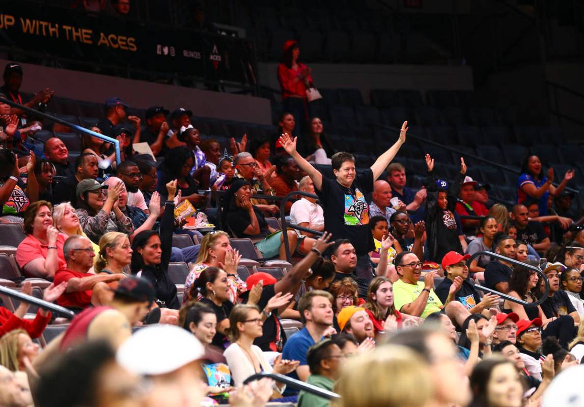 Las Vegas Aces fans cheer during the first half of a WNBA basketball game against the Washingto ...