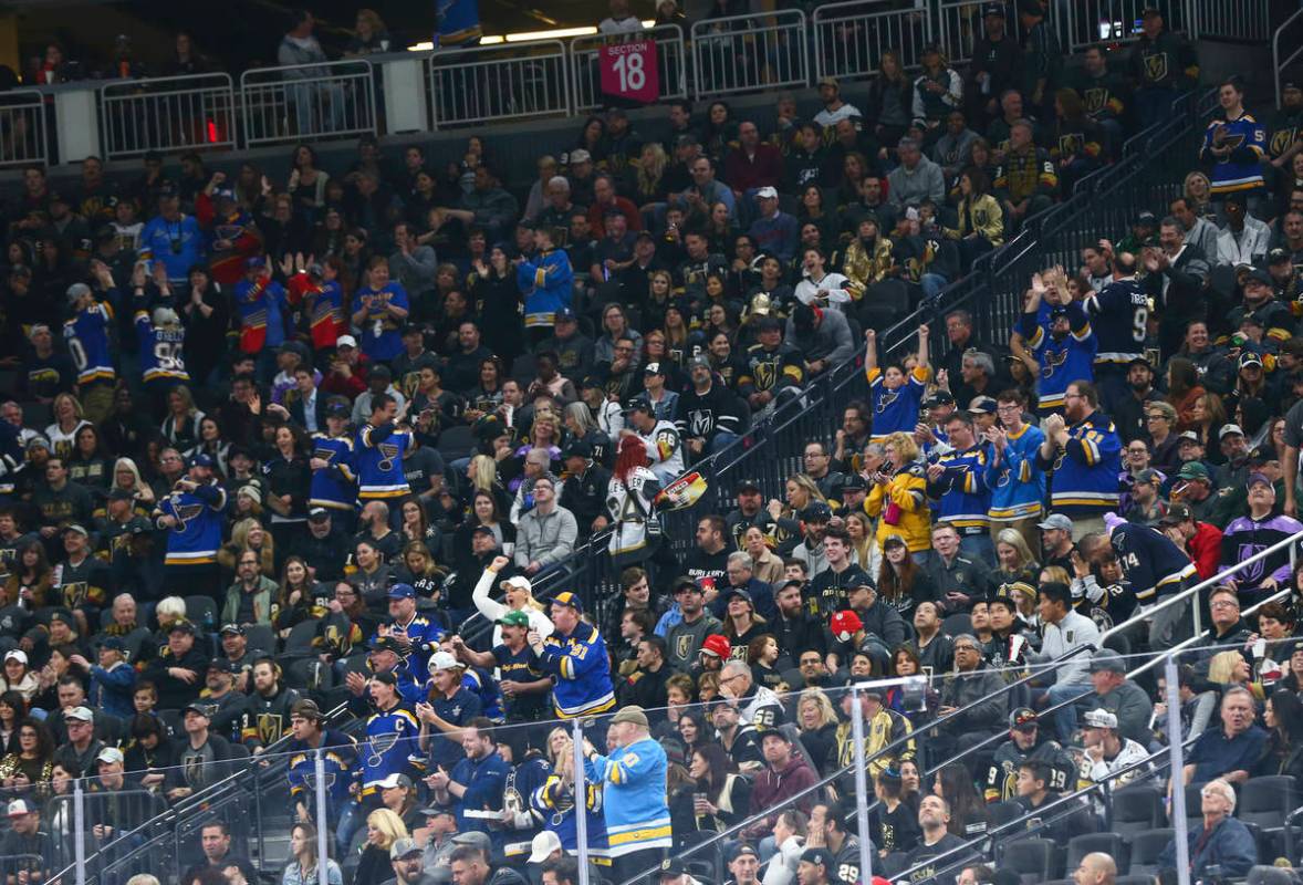 St. Louis Blues fans celebrate their team's first goal against the Golden Knights in the first ...