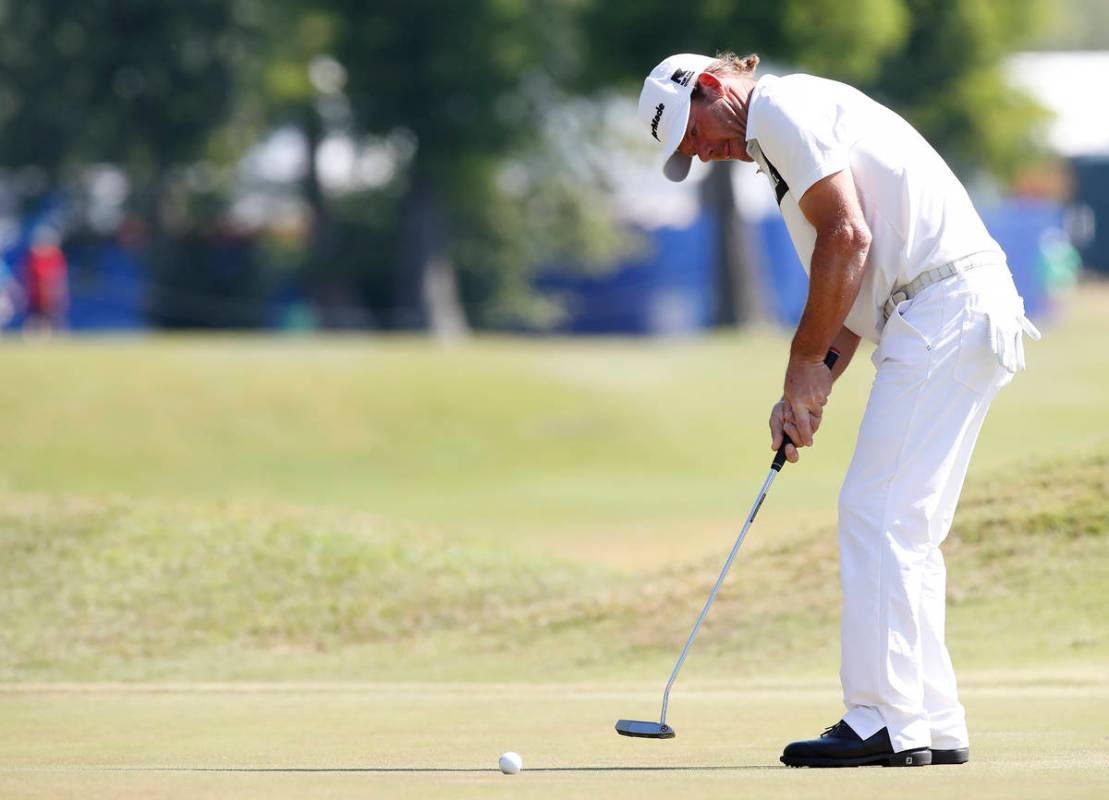 Alex Cejka, of Germany, putts on the first green during the final round of the PGA Zurich Class ...