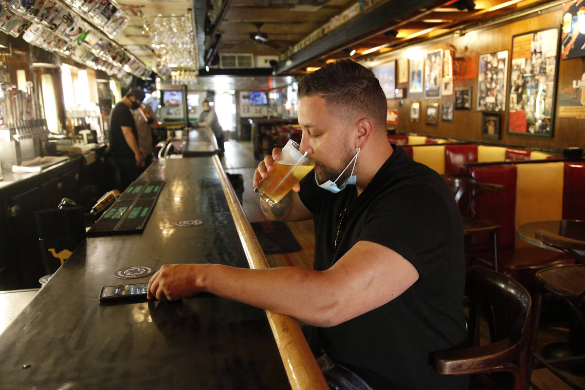 Cheers to You patron Mike Turner drinks a beer at the bar Friday, May 1, 2020, in Salt Lake Cit ...