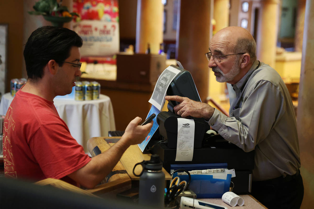 Mike O'Brien of Las Vegas, left, places an order with Bob Ansara, owner of Ricardo's restaurant ...